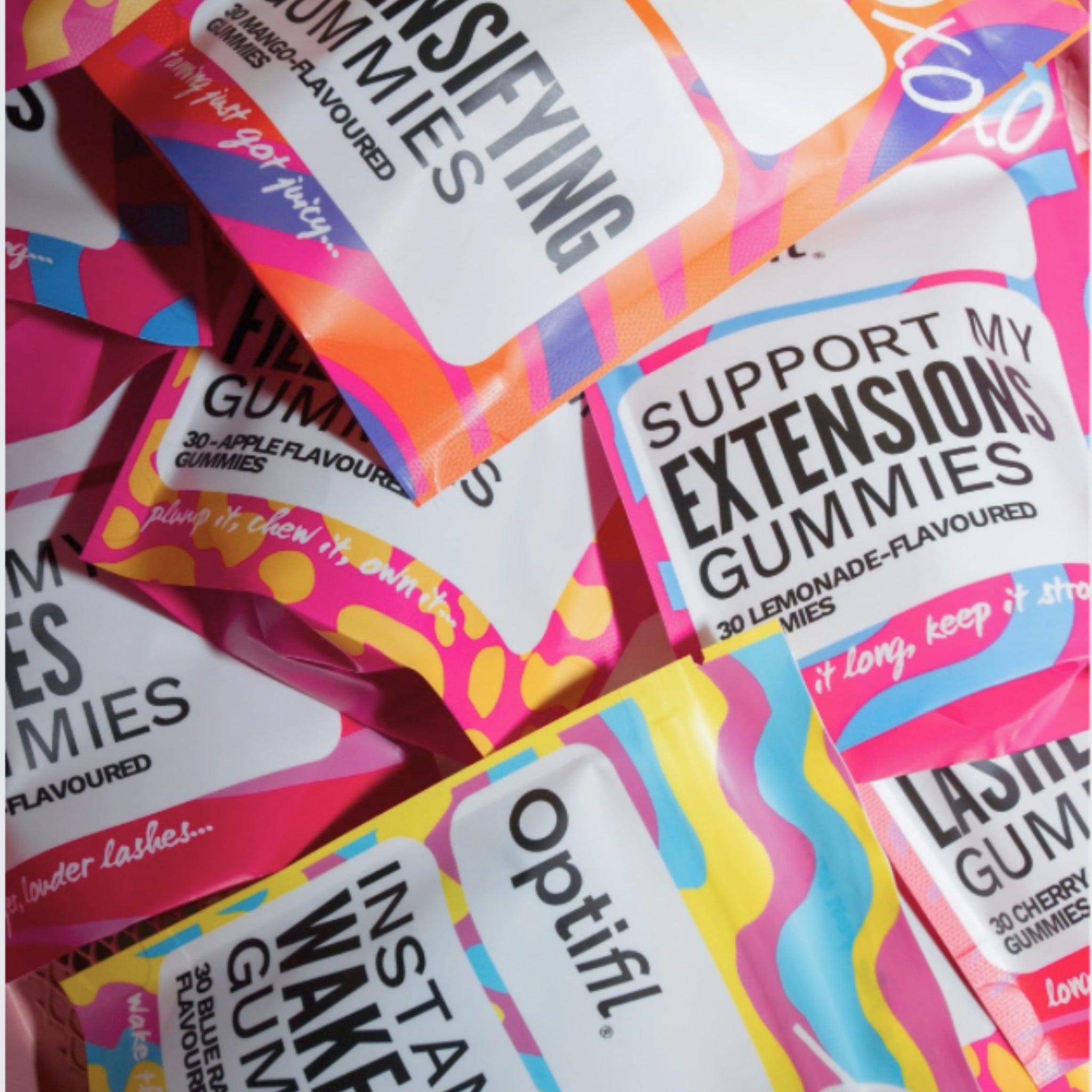 Overhead view of Optifil Beauty Gummies UK displayed in premium stand-up packaging alongside colourful gummies.