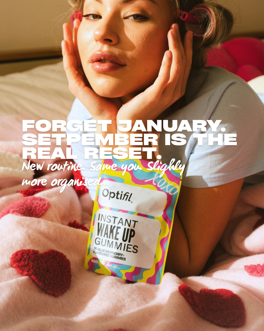 Model lay down with Optifil Instant Wake Up Gummies Infront of her